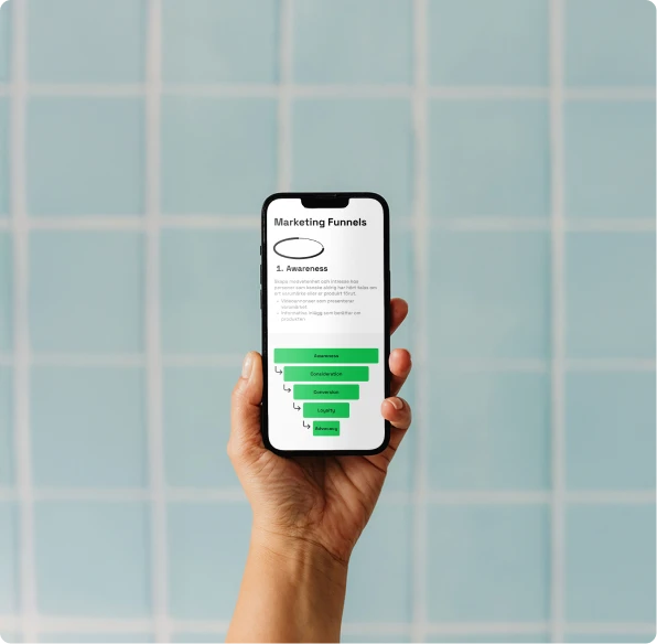 Hand holding up phone displaying Qase's website