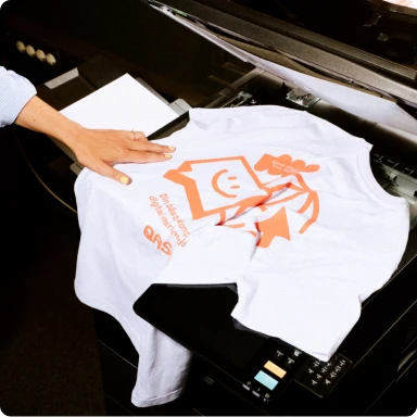 T-shirt folded over a black table